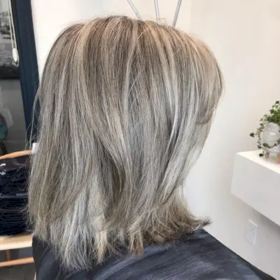 layered salt and pepper long bob hairstyle
