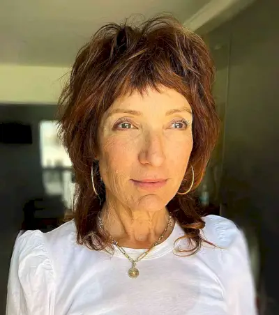 Shaggy Wolf Cut with Fringe for Older Women with dark copper hair color