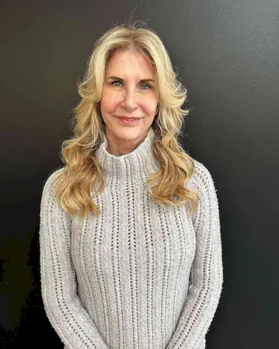 Golden Blonde Shag with Curtain Bangs for Older Ladies with longer hair