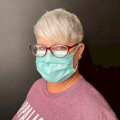 Classic Pixie with Side-Swept Bangs on Mature Women