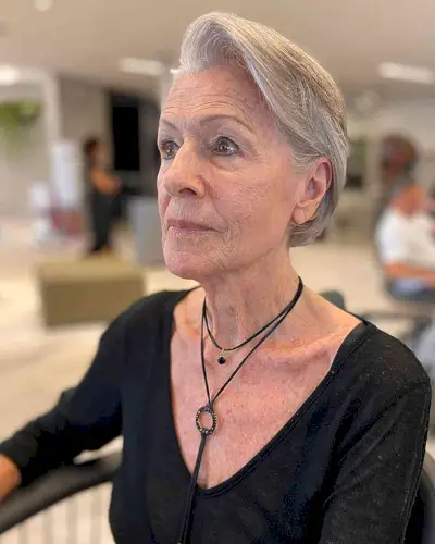 Voluminous Side-Parted Short Hair for 60-Year-Olds with Grey Hair and an oval face
