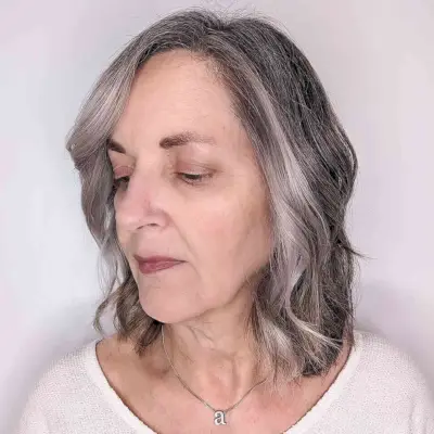 Neck-Length Layered Hair with Waves for a 60-Year-Old Lady