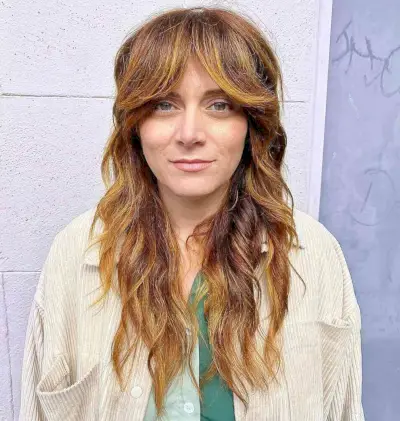 Longer Shaggy Haircut with Face-Framing Bangs for forty year old ladies