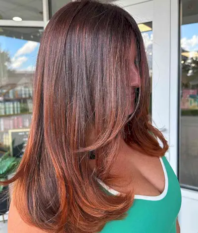 Medium-Length Copper Hair with Lighter Ends for Fall and Mature Ladies Aged 40