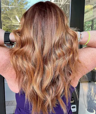 Low-Maintenance Strawberry Blonde Long Hair for Fall and Women Aged 40