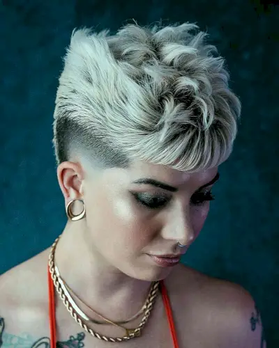 Edgy Platinum Messy Top with a Mid Fade for Older Women with textured hair