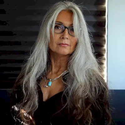 Long Silver Hairstyle for Women Over 50 with Glasses