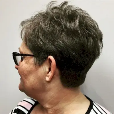 Stylish Textured Cut for Thick Hair for woman over fifty with glasses