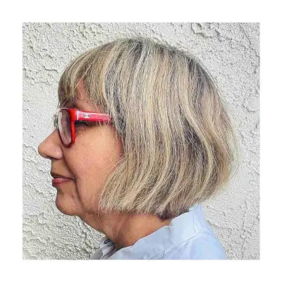 Face Framing Short Haircut with Bangs and Glasses for 60 year olds