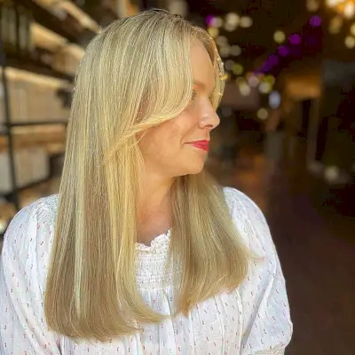 Face-Framing Bangs on Straight Blonde Long Hair on Women of Age 50