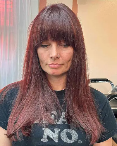 Eye-Grazing Fringe for Straight and Long Dark Red Hair on Older Ladies Aged 50