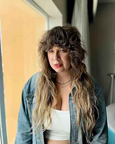 Textured Long Shag with Wavy Bangs on Women over 50 and up