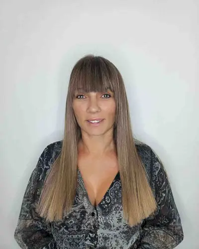 Chest-Length Blunt Haircut with Sleek Fringe for women in their 50s