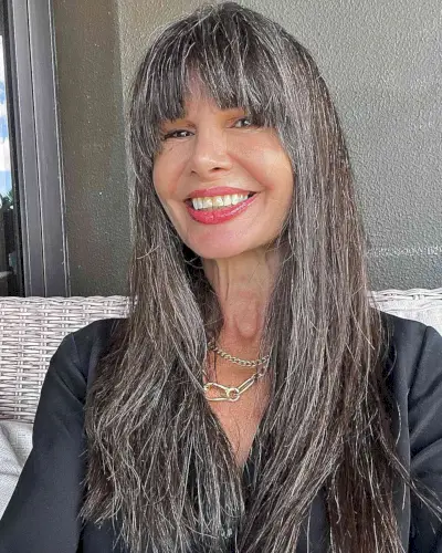 Long Subtle Layers with French Bangs for Mature Women Over 50