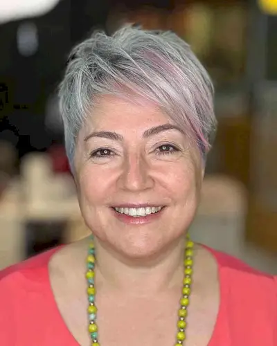 Sweeping Long Pixie with Pink Highlights for Women Aged 50 with a Round Face