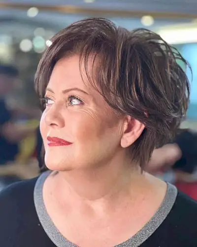 Short, Heavily Layered Hairstyle for 50-year-olds with Round Faces