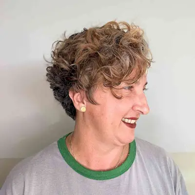 Short Messy Pixie with Piece-y Layers and Curls for 50-year-old Ladies