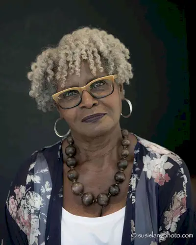 Ear-Length Mini Curly Bowl Cut with Layers for Older Black Women with Specs