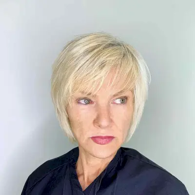Short Wispy Blonde Bob with Side-Swept Bangs for Women 40 and Up