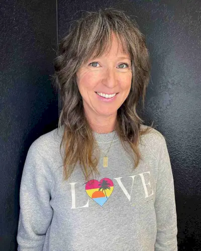 Choppy Brunette Hair with See-Through Bangs for 40-Year-Olds