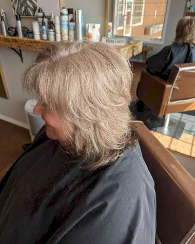 Textured Shoulder-Length Cut with Feathered Chopped Layers on ladies over sixty