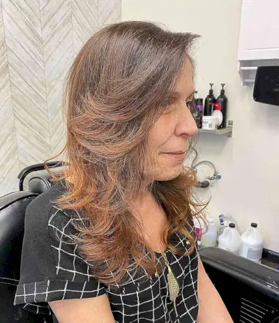 Voluminous Long Feathered Layers and Bangs on Older Ladies Past 60 with Brunette Hair