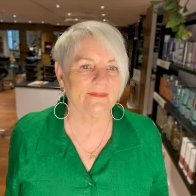 long choppy pixie with bangs for women in their 60s with gray hair
