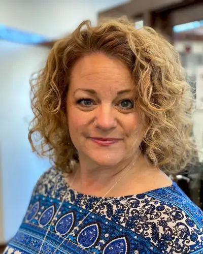 Curly hair style for senior women with round face