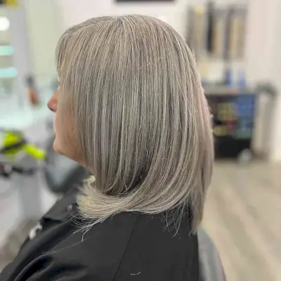 Medium Grey Hair with Ash Brown Hue for Older Women Aged 50