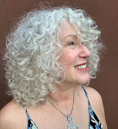 White Rezo Cut Curls for 50-Year-Olds with Round Faces and shoulder-length hair