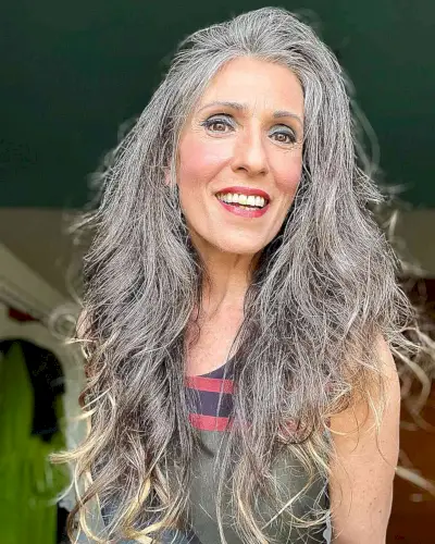 Voluminous Textured Long Hair with Blonde Tips for Older Women Over 60 with Dense Hair