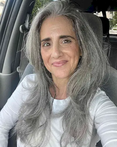 Chest-Length Soft Layered Hair with Flipped-Up Ends for 60-Year-Old Women with Thicker Locks