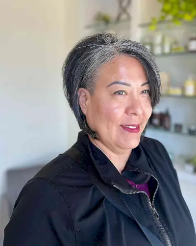 Jaw-Length Stacked Bob Cut with Hidden Undercut for Overweight 50-Year-Old Women