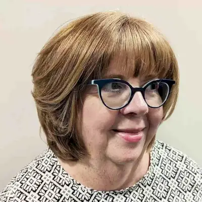 Neck-Length Round Bob with Wispy Bangs for Plus Size Women Over Fifty with Glasses