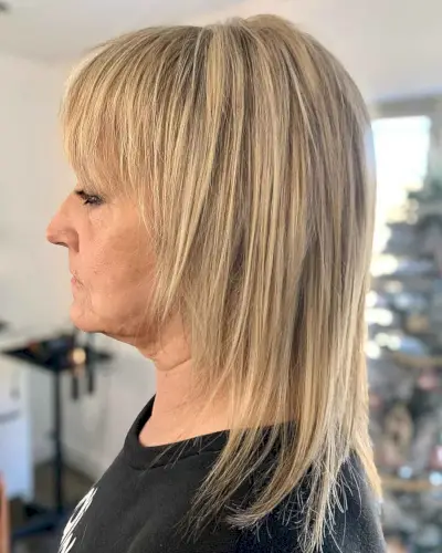 Mid-Length Straight Shag with Choppy Bangs for Women Over 60