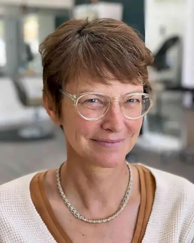 Soft Pixie Style with Sweeping Fringe for Mature Ladies Aged 50 Wearing Glasses