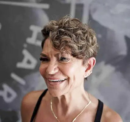 Side Part Pixie Crop with Curly Bangs for older women over 50