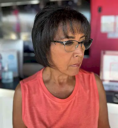 Layered Chin Bob with Wispy Bangs for Mature Women Over 50 with Glasses