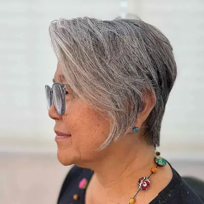 Easy-Maintenance Natural Grey Pixie with Long Bangs for Seniors Aged 50 with Specs