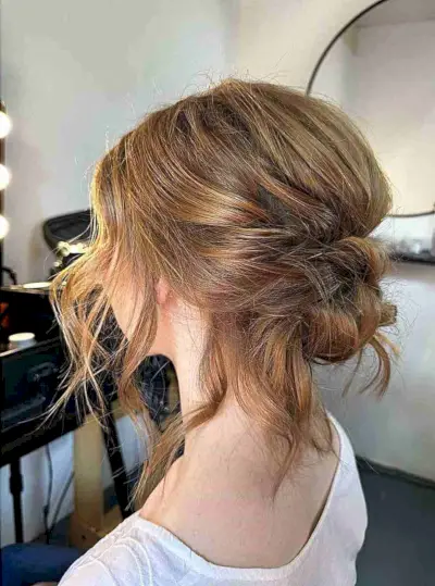 Low Bouffant Updo with a Face Frame and Choppy Layers for Thin-Haired Women