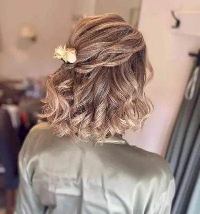 Soft Half Updo with Airy Curls and Rose Hair Pieces on Dark Blonde Hair