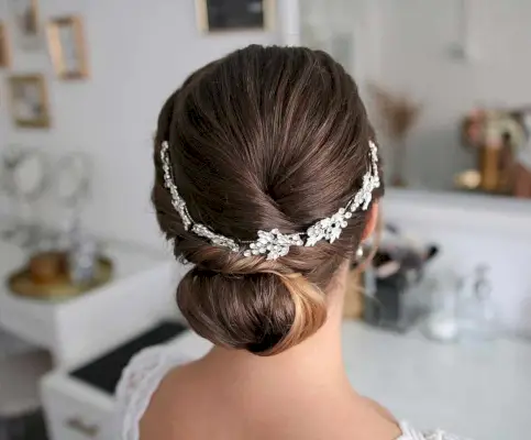 Mid-Length Rolled Down-Do Style with a Vine Hairpiece for Prom