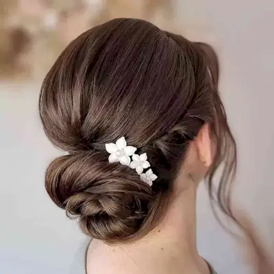 Mid-Length Twisted Low Bun with Flower Accessories for Prom