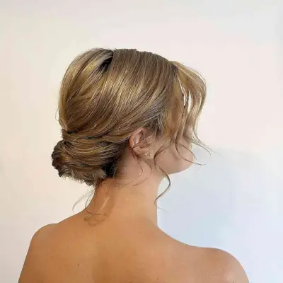 Medium-Length Effortless Sleek Low Bun for Prom