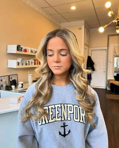 Soft Waves and Blonde Highlights Perfect for Prom Down Style