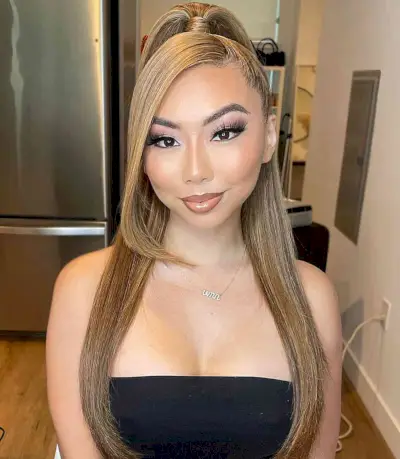 Sleek Half Ponytail Down Hairstyle with a Deep Side Part for Prom