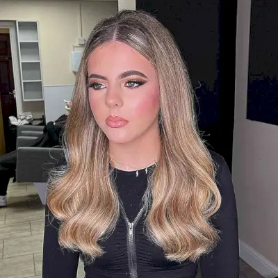 Soft Teased Style and Long Subtle Waves Parted in the Middle Prom Down Hair