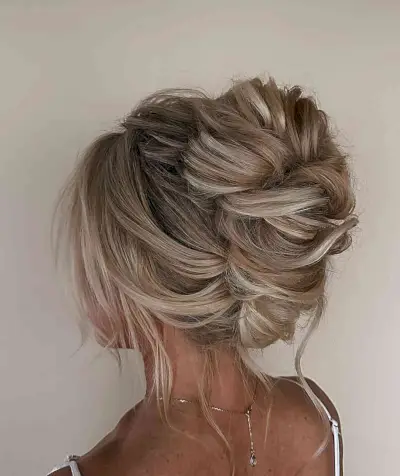 Boho French Twist Bun with Wavy Pieces for Prom