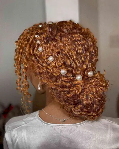 Curly Copper Low Bun with Pearls for prom