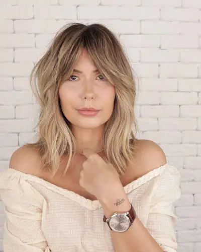 Low-Maintance Shag Hairstyle with Curtain Bangs